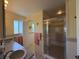 Bathroom featuring double sinks and shower stall at 6361 Turtlemound Rd, New Smyrna Beach, FL 32169