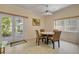 Dining area with a ceiling fan, and French doors to the outdoor patio seating at 6361 Turtlemound Rd, New Smyrna Beach, FL 32169