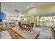 Bright dining area with ample natural light, a charming table, bar seating and modern kitchen at 6361 Turtlemound Rd, New Smyrna Beach, FL 32169