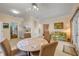 Open dining area with tile floors, comfortable seating, and easy access to the kitchen and living spaces at 6361 Turtlemound Rd, New Smyrna Beach, FL 32169
