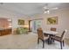 Cozy dining area with adjacent living space and access to the bedroom, creating a comfortable and inviting atmosphere at 6361 Turtlemound Rd, New Smyrna Beach, FL 32169