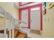 Inviting entryway with a staircase and front door at 6361 Turtlemound Rd, New Smyrna Beach, FL 32169