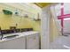 Functional laundry room equipped with a washer, dryer, and shelving at 6361 Turtlemound Rd, New Smyrna Beach, FL 32169