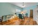 Inviting living room with natural light, wood floors, and simple decor at 6361 Turtlemound Rd, New Smyrna Beach, FL 32169