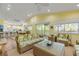 Open-concept living area with sliding glass doors to the outside deck and modern kitchen at 6361 Turtlemound Rd, New Smyrna Beach, FL 32169