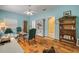 Cozy living room featuring wood floors and plenty of space at 6361 Turtlemound Rd, New Smyrna Beach, FL 32169