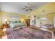 Spacious bedroom features a large bed, wood floors, and ample closet space at 6361 Turtlemound Rd, New Smyrna Beach, FL 32169