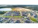 Panoramic aerial view of a community with a pool, ponds and green landscape at 6542 Rover Way, St Cloud, FL 34771