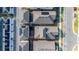 Directly above aerial shot of neatly arranged homes, displaying roof lines, solar panels, and streetscapes within a community at 6542 Rover Way, St Cloud, FL 34771