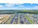 Sprawling aerial view of a community featuring scenic water features and modern homes at 6542 Rover Way, St Cloud, FL 34771