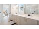 Modern bathroom with double sinks, granite countertops and elegant fixtures at 6542 Rover Way, St Cloud, FL 34771