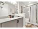 Modern bathroom with a single vanity, granite countertop, framed mirror and shower-tub combination at 6542 Rover Way, St Cloud, FL 34771
