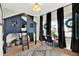 Playroom with house-shaped bunk and play area, featuring hardwood floors and large windows for natural light at 6542 Rover Way, St Cloud, FL 34771