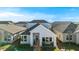 Charming single-story home with a welcoming front porch and well-maintained landscaping in a friendly neighborhood setting at 6542 Rover Way, St Cloud, FL 34771