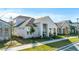 Inviting home featuring a covered entryway, verdant landscaping, and modern architectural details in a suburban community at 6542 Rover Way, St Cloud, FL 34771