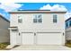 Two-story home featuring a two-car garage and neutral exterior paint at 6542 Rover Way, St Cloud, FL 34771