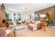 Spacious living room featuring a comfortable seating arrangement, stylish decor, and an open floor plan at 6542 Rover Way, St Cloud, FL 34771