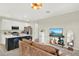 Inviting living space with open kitchen, breakfast bar, and comfortable seating area at 6542 Rover Way, St Cloud, FL 34771