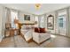 Bright main bedroom with neutral decor, hardwood flooring, a ceiling fan and two windows at 6542 Rover Way, St Cloud, FL 34771