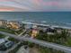 Aerial view of beachfront homes, showcasing ocean access and premier location at 6771 Turtlemound Rd, New Smyrna Beach, FL 32169