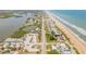 Aerial view showcasing the property's proximity to both the ocean and the Halifax River at 6771 Turtlemound Rd, New Smyrna Beach, FL 32169