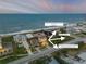 Aerial view of a coastal community, highlighting proximity to the beach and local amenities at 6771 Turtlemound Rd, New Smyrna Beach, FL 32169