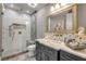 Modern bathroom with glass shower, marble countertop, and designer fixtures at 6771 Turtlemound Rd, New Smyrna Beach, FL 32169