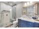 Bathroom showcasing a glass shower, marble countertop, and a decorative backsplash at 6771 Turtlemound Rd, New Smyrna Beach, FL 32169