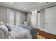 This bedroom features a balcony, white cabinetry, hardwood floors and recessed lighting at 6771 Turtlemound Rd, New Smyrna Beach, FL 32169