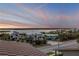 Expansive water views at sunset from this home, nestled amongst lush palms and tropical landscaping at 6771 Turtlemound Rd, New Smyrna Beach, FL 32169