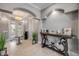 Inviting foyer with chandelier lighting, tile floors, decorative table, and stylish accents for an open and airy feel at 6771 Turtlemound Rd, New Smyrna Beach, FL 32169