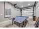 Spacious game room with ping pong table, perfect for entertaining guests and enjoying recreational activities at 6771 Turtlemound Rd, New Smyrna Beach, FL 32169