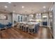 Spacious kitchen features a large island with seating, modern appliances, and a view to the dining area at 6771 Turtlemound Rd, New Smyrna Beach, FL 32169
