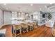 Bright kitchen features a large island with bar seating, pendant lighting, and stainless steel appliances at 6771 Turtlemound Rd, New Smyrna Beach, FL 32169