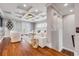 Spacious living room offers tray ceilings, hardwood floors, and ample seating with great natural light at 6771 Turtlemound Rd, New Smyrna Beach, FL 32169