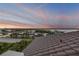 Beautiful Halifax River view at dusk from rooftop over terracotta colored clay tile at 6771 Turtlemound Rd, New Smyrna Beach, FL 32169