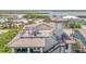 Aerial view of the rooftop deck with chairs and table at 6771 Turtlemound Rd, New Smyrna Beach, FL 32169