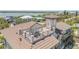 Aerial view of the rooftop deck with seating and beautiful views at 6771 Turtlemound Rd, New Smyrna Beach, FL 32169