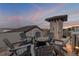 This rooftop patio area features a tile floor, seating for six and panoramic views at 6771 Turtlemound Rd, New Smyrna Beach, FL 32169