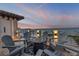 This rooftop patio area features a tile floor, seating for six and ocean views at 6771 Turtlemound Rd, New Smyrna Beach, FL 32169