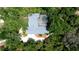 Aerial view of home showing the screened pool and the mature landscaping surrounding the property at 682 Ferncliff Dr, Port Orange, FL 32127