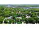 Aerial view of property, surrounded by mature trees; lot lines are indicated by blue dotted line at 682 Ferncliff Dr, Port Orange, FL 32127