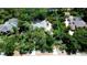 Aerial view of a landscaped property including a large home and an in-ground pool at 682 Ferncliff Dr, Port Orange, FL 32127