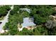 Aerial view of a landscaped property including a large home, a pool, and nice landscaping at 682 Ferncliff Dr, Port Orange, FL 32127