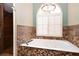 Modern bathroom with a soaking tub and separate shower at 682 Ferncliff Dr, Port Orange, FL 32127