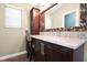 Bathroom vanity with a framed mirror at 682 Ferncliff Dr, Port Orange, FL 32127