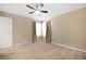 Neutral bedroom features carpeted floors and natural lighting at 682 Ferncliff Dr, Port Orange, FL 32127