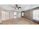 Bedroom with ceiling fan, accent wall and carpet at 682 Ferncliff Dr, Port Orange, FL 32127