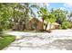 Charming single-story brick home with a three car garage, and a large driveway at 682 Ferncliff Dr, Port Orange, FL 32127