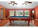 Spacious game room with pool table, ceiling fans, and large windows offering abundant natural light at 682 Ferncliff Dr, Port Orange, FL 32127